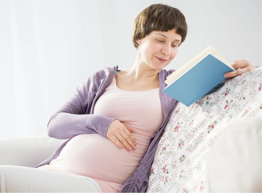Mom holding baby in arms at home